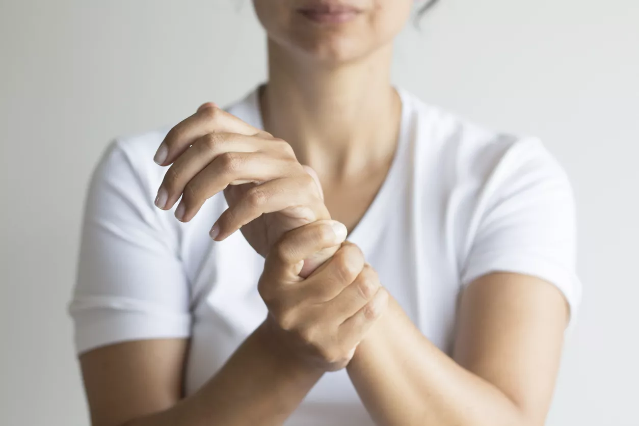 Woman holding her wrist in pain