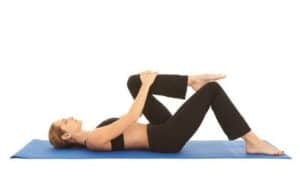 Woman stretching on a yoga mat