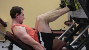 Man working out on the leg machine
