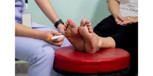 The doctor examines the nerve response with monofilament odiatrist treating feet during procedure for By working directly with a professional physical therapist, the diabetic patient can safely take advantage of all the benefits offered by physical activity, while being under the direct guidance of someone who understands their unique health challenges of diabetic peripheral neuropathy.