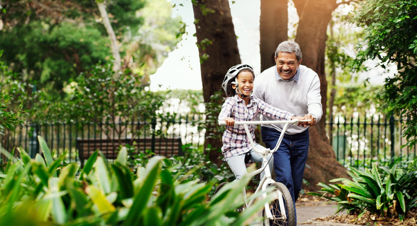 Grandparent and kid riding bike